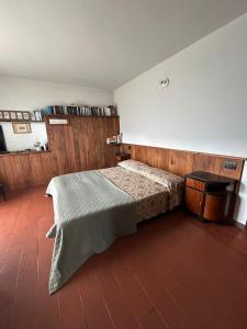 Postelja oz. postelje v sobi nastanitve Guest House nel Vigneto