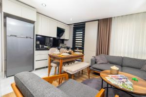 a kitchen and living room with a couch and a table at Luxury Life Suites in Istanbul +37 photos