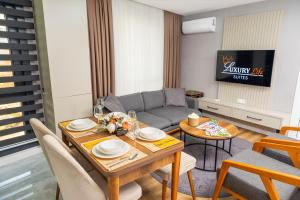 a living room with a table and a couch at Luxury Life Suites in Istanbul