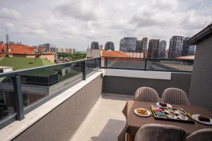 a balcony with a table with plates of food on it at Luxury Life Suites in Istanbul