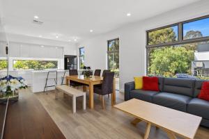 a living room with a couch and a table at Prospect High Street House in Prospect