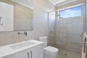 a bathroom with a toilet and a sink and a shower at Prospect High Street House in Prospect +20 photos
