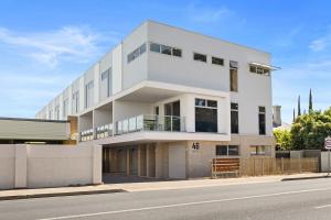 a white building on the side of a street at Prospect High Street House in Prospect