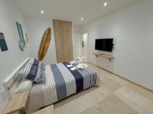 TV a/nebo společenská místnost v ubytování Villa Eden - Le luxe près des vignobles charentais