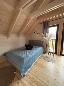 Postel nebo postele na pokoji v ubytování UNO Dom Kopalino