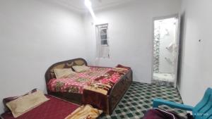 Postel nebo postele na pokoji v ubytování Gulzar Guest house 6bhk