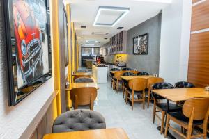 a dining room with wooden tables and chairs at Luxury Life Suites in Istanbul