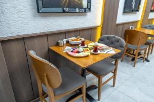 a table with food on it in a restaurant at Luxury Life Suites in Istanbul