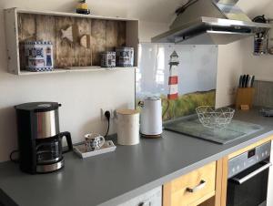 a kitchen with a counter top with a coffee maker at Ferienwohnung Kalle in Osterbruch