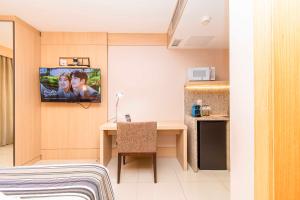 TV a/nebo společenská místnost v ubytování Cullinan Diárias Brasil 62634