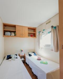 Posteľ alebo postele v izbe v ubytovaní Camping La Sirena