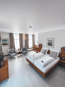 Postel nebo postele na pokoji v ubytování Hotel Tillmanns