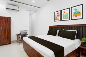Postel nebo postele na pokoji v ubytování Super Hotel O Bhangel Dadri Road Noida