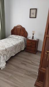 Łóżko lub łóżka w pokoju w obiekcie Vivienda Vacacional Florentina