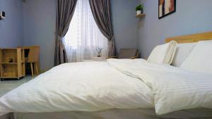 Vuode tai vuoteita majoituspaikassa Seven Space Coliving