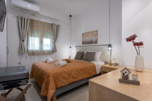 Postel nebo postele na pokoji v ubytování Avra 1 modern seaview home