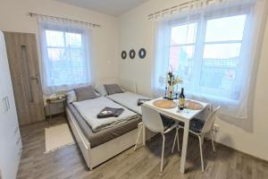 Postel nebo postele na pokoji v ubytování Apartmány Daros