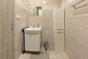Koupelna v ubytování Apartmány Daros + 27 fotografií