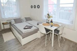 Postel nebo postele na pokoji v ubytování Apartmány Daros