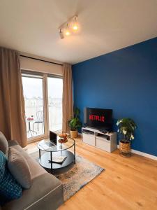 Televízia a/alebo spoločenská miestnosť v ubytovaní Lumina premium apartments for a family