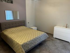 a small bedroom with a bed and a dresser at "Casa Viola" via Camillo CARLOMAGNO 26 in Isernia