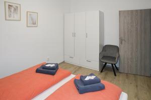 Postel nebo postele na pokoji v ubytování Apartmány Daros
