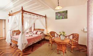 Postel nebo postele na pokoji v ubytování Relais Des Gouverneurs
