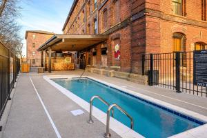a swimming pool in front of a building at All Access Pass #104 in Nashville