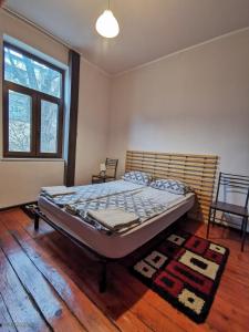 a bedroom with a bed in a room at Hot Spot 2bdrm apartment 1 in Sofia