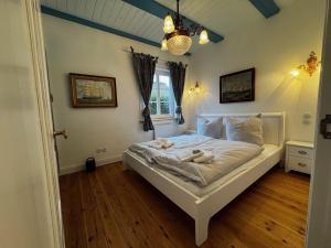 Postel nebo postele na pokoji v ubytování Det Danske Hus - Wohnung Steuerbord