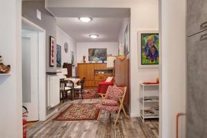 a hallway with a living room and a dining room at appartamento Monika con parcheggio in Volano