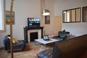 TV a/nebo společenská místnost v ubytování L'Opaline