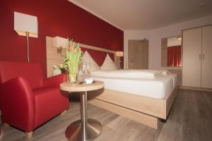 Postel nebo postele na pokoji v ubytování Hotel Sonne am Meer