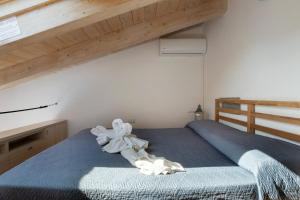 Una cama o camas en una habitación de Il Giostro 1 Biassa