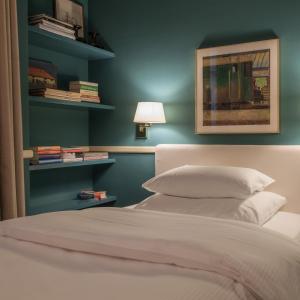 Uma cama ou camas num quarto em Hotel Kindli