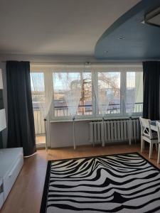 En eller flere senge i et værelse på Apartament Jodełka