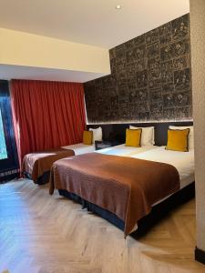 Postel nebo postele na pokoji v ubytování Hotel Sebastians