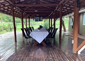 a table and chairs on a covered patio at Zebi Ecolodge in Hoima +24 photos