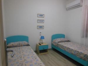 Postel nebo postele na pokoji v ubytování PUNTO ZERO ROOMS