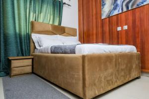 Voodi või voodid majutusasutuse T-Square Residence Makepe toas