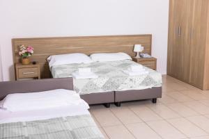 San Luigi - Residenza Gemelli客房内的一张或多张床位