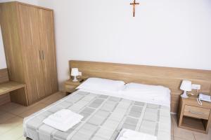 San Luigi - Residenza Gemelli客房内的一张或多张床位