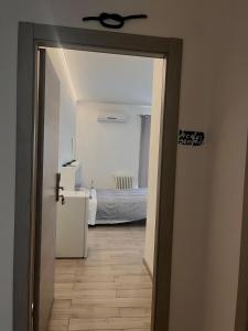 Postel nebo postele na pokoji v ubytování piazza Marconi Rooms