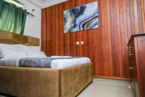 Voodi või voodid majutusasutuse T-Square Residence Makepe toas