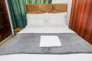 Voodi või voodid majutusasutuse T-Square Residence Makepe toas