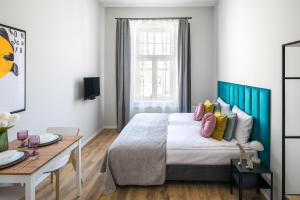 Posteľ alebo postele v izbe v ubytovaní Horizon Park Aparthotel