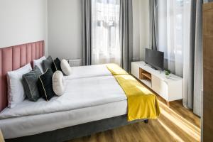 Posteľ alebo postele v izbe v ubytovaní Horizon Park Aparthotel