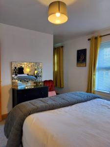 Katil atau katil-katil dalam bilik di Cozy Holiday Home in the Scenic Glen of Aherlow
