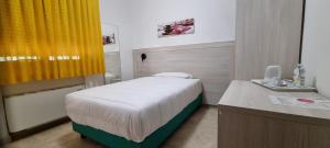 A bed or beds in a room at Hotel I Platani