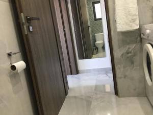 a bathroom with a toilet and a sink and a mirror at Mediterranean Apartments 1 in Paphos City +32 photos